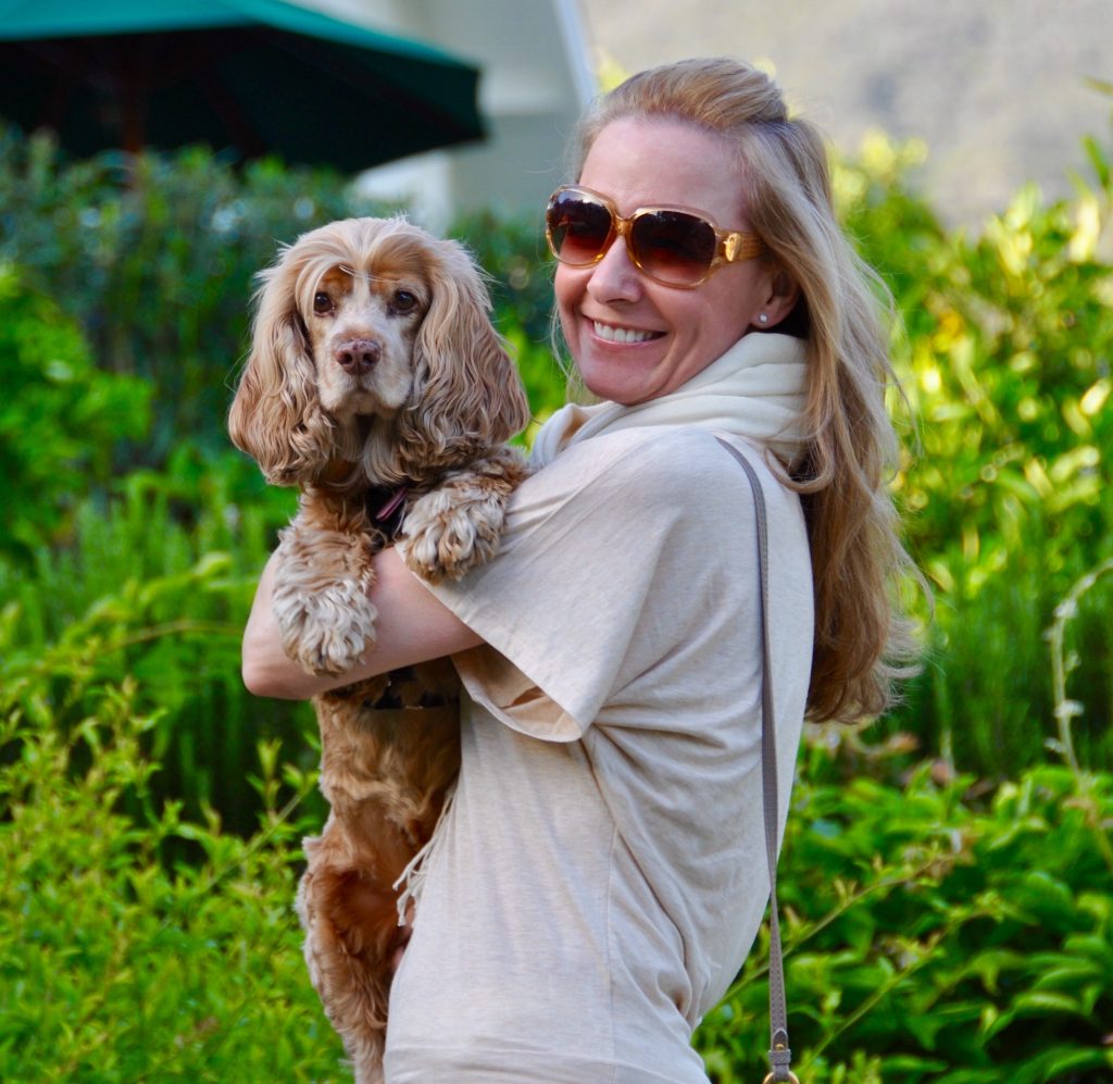 Lange Foundation supporter Sandra Page Mitchell holding Bailey